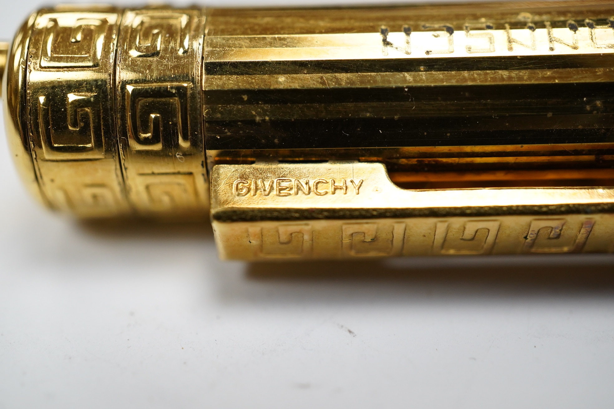 A Cartier gold plated pen and a Givenchy 18ct gold plated pen, both boxed. Cartier pen 13.5cm long. Condition - good, Givenchy box needs attention